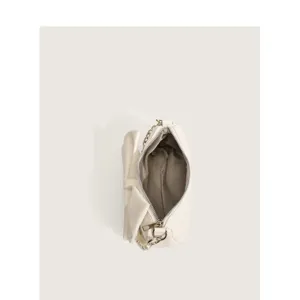 White bow underarm shoulder bag for women, chic PU leather purse with chain and pearl details.