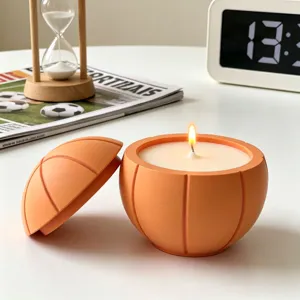 Detailed view of the creative orange basketball shaped scented candle, decorative wax and lid.