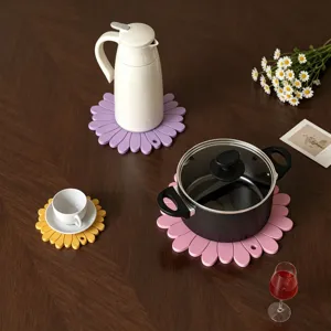 Silicone flower coaster detail view, flexible daisy mold for tabletop decor and insulation.