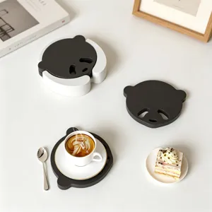 Cute panda coaster set with storage holder, modern black and white table mat for home decor.