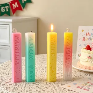 Scented pillar candles set with engraved English words, colorful decorative wax sticks for home.