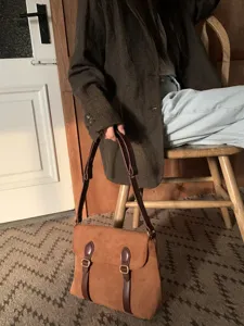 Vintage suede messenger bag for women, retro crossbody shoulder bag with double buckle design.