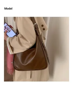 Retro large-capacity brown PU leather shoulder bag, casual hobo bag with side metal details.