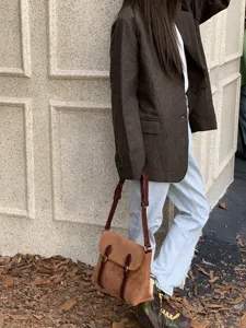 Vintage suede messenger bag for women, retro brown crossbody shoulder bag for daily wear.