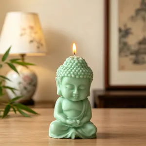 Zen meditating Buddha scented candle close-up, calming green wax decor for home relaxation.