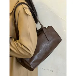 Retro brown barrel shoulder bag for women, casual commuter PU leather handbag main view.