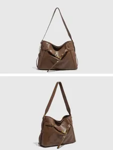 Brown leather shoulder bag, large capacity retro motorcycle tote bag for women daily commuting style.