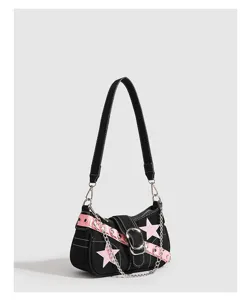 Y2K black shoulder bag detail view with pink belt, silver chain, and star graphic.