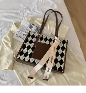 Stylish black and white argyle tote bag with brown trim and large capacity commuter shoulder bag.