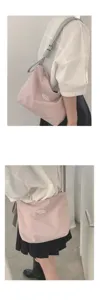 Casual pink canvas shoulder bag detail, stylish underarm tote bag for women daily wear.
