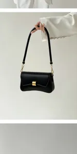 Minimalist solid color underarm shoulder bag for urban women, chic baguette handbag style.