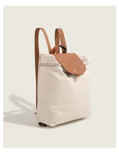 Casual nylon backpack for women with brown leather flap, spacious school bag detail view.