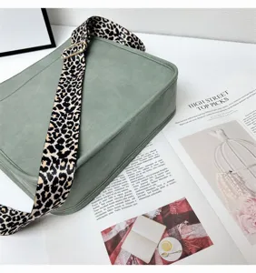 Green shoulder bag with stylish leopard print wide strap, perfect for daily fashion and casual use.