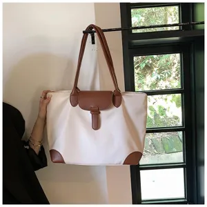 Stylish women's large capacity tote bag, elegant beige fabric with brown leather trim.