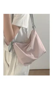 Casual pink underarm bag for women, stylish contrast shoulder handbag with adjustable strap.