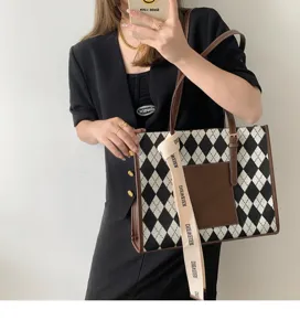 Commuter tote bag with black and white argyle pattern, large capacity handbag for women detail view.