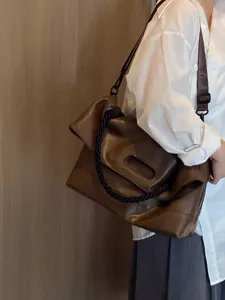 Brown soft leather tote bag, large capacity shoulder and crossbody bag for autumn commuting.