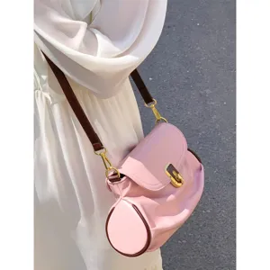 Pink soft leather shoulder bag for women, chic contrast color crossbody dumpling purse.