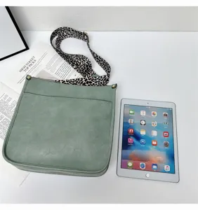 Women's green crossbody bag with leopard print wide strap and front pocket casual tote