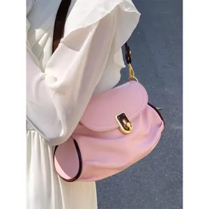 Rose pink soft leather shoulder bag with chic pleated design, elegant gold lock and contrast trim.
