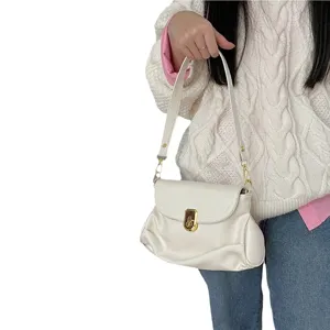 Stylish minimalist soft leather underarm shoulder bag for women, chic pleated design, elegant.