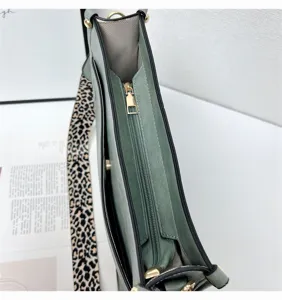 Fashion green shoulder bag with trendy leopard wide strap, large capacity bucket design.