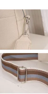 Detailed close-up view of the women pu leather crossbody bag featuring a wide strap.