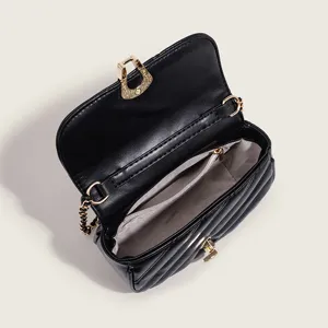 Black quilted chain crossbody bag for women, luxury style designer shoulder handbag.