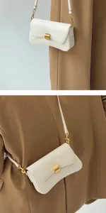 Elegant white leather shoulder baguette bag for women, minimalist underarm handbag with gold hardware.