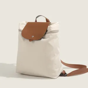 Casual nylon backpack with stylish brown flap design, large capacity for daily school and travel.