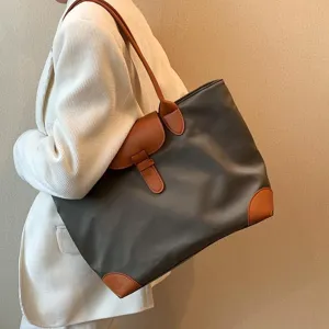 Women large capacity commuter tote bag, stylish shoulder bag for daily office and school use.