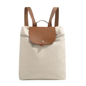 Stylish nylon backpack for women casual daily daypack with contrast brown leather flap design.