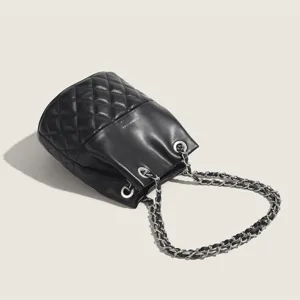 Black quilted bucket bag with chain strap, stylish leather crossbody bag for women daily commute.