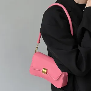 Stylish pink shoulder underarm bag for women, elegant casual baguette bag with metal clasp.