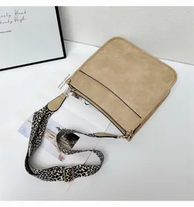 Khaki suede shoulder bag with chic leopard wide strap, stylish crossbody tote design.