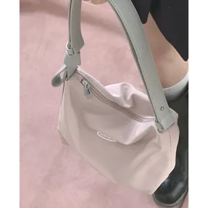 Casual pink shoulder bag for women with grey strap, stylish hobo tote bag for daily use.