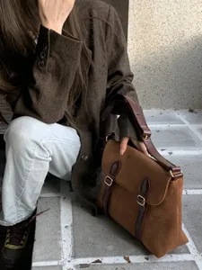Retro suede messenger bag detail shot, vintage brown crossbody bag for women, elegant daily wear.