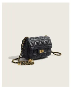 Black quilted crossbody bag with gold chain strap, luxury style shoulder bag for women.