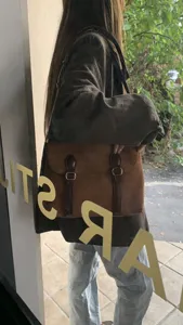 Retro brown suede messenger bag detail, vintage style crossbody bag with double buckle design.