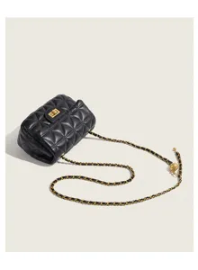 Black quilted crossbody mini bag with luxury gold chain and metal adjustment ball details