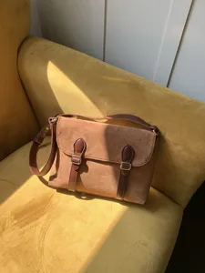 Retro brown suede messenger bag detail, vintage shoulder crossbody bag for women daily use.