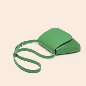 Green PU leather chestnut saddle bag, retro minimalist crossbody shoulder bag for women.