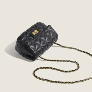 Black quilted chain shoulder bag for women, stylish crossbody handbag with gold hardware.