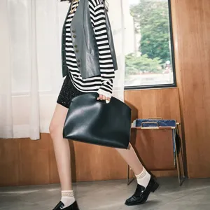 Minimalist black laptop sleeve bag for women, stylish commuting briefcase hand bag main view.