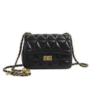 Black quilted leather crossbody bag for women with gold chain strap and metal ball decor.