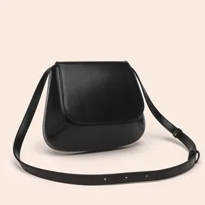 Close-up detail of smooth black PU leather flap saddle bag with clean stitching and strap.