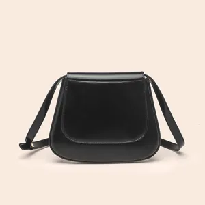 Classic black PU leather saddle bag detail, elegant curved flap design for women shoulder wear.