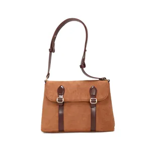 Vintage brown suede messenger bag for women, retro shoulder crossbody bag with buckle straps.