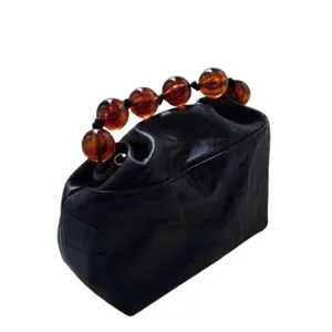 Vintage black leather handbag with amber beaded handle, elegant Chinese style fashion bag for women.