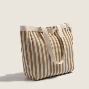 Casual striped canvas tote bag for women, large capacity shoulder bag for daily commute.